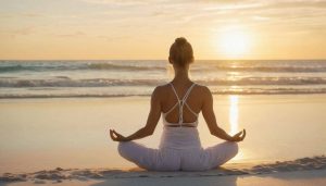 a woman doing yoga for stress relief sitting on a beach