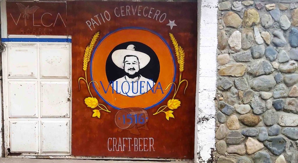 a mural on a wall of a man wearing a hat