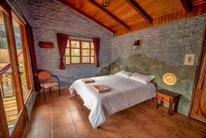 a room with a bed and a chair